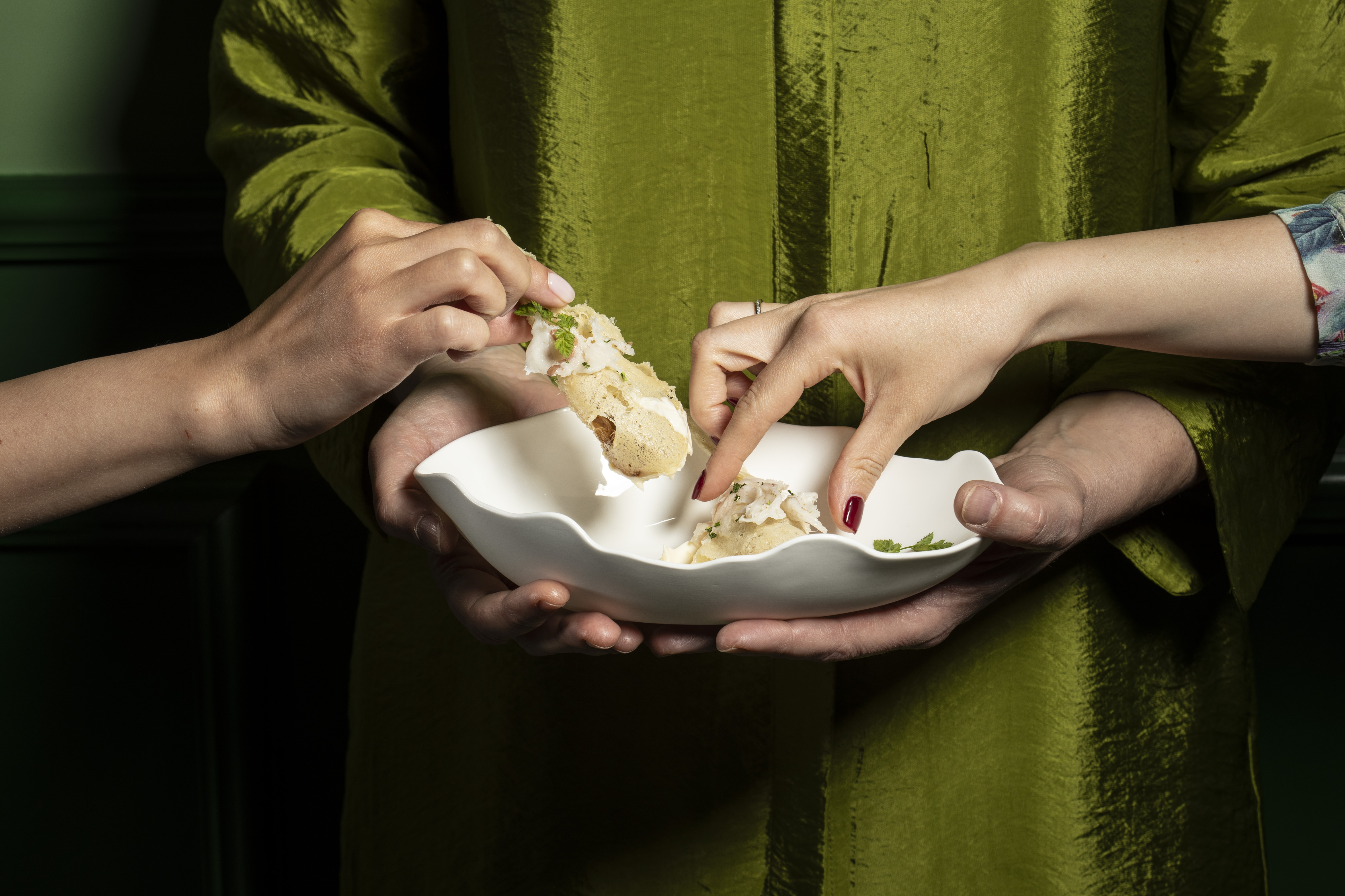 Hands sharing pintxos at La Gemma Cafe