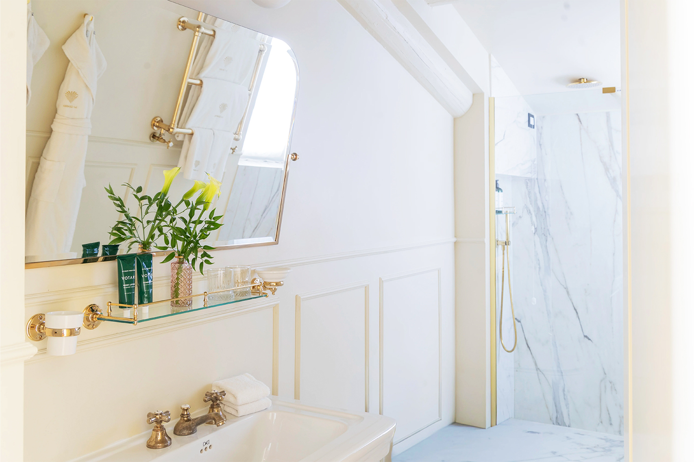 Prestige Suite marble bathroom with sink and shower