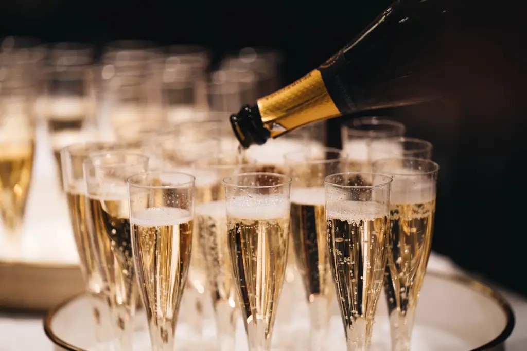 A chilled bottle of champagne being poured